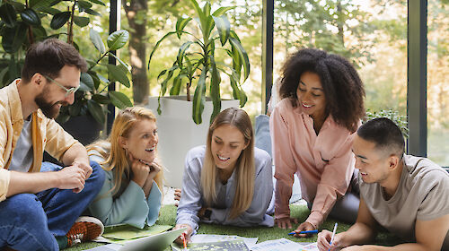 Five people working together